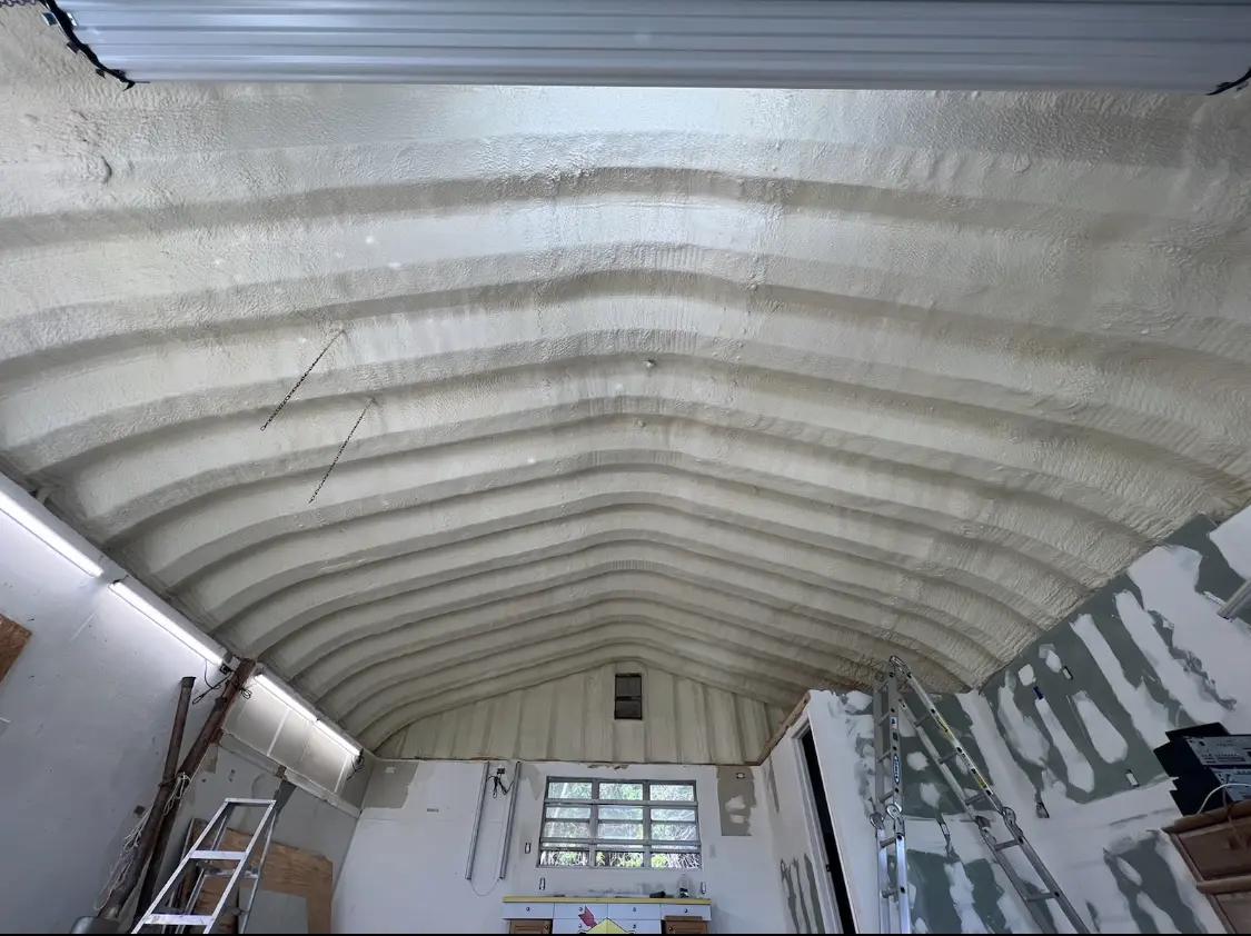 Spray polyurethane foam applied to the underside of a metal roof deck in Centralia